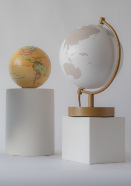 two globes on pedestals
