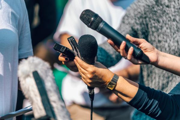 Journalists interviewing people