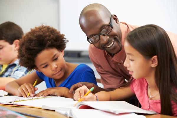 A teacher helping students