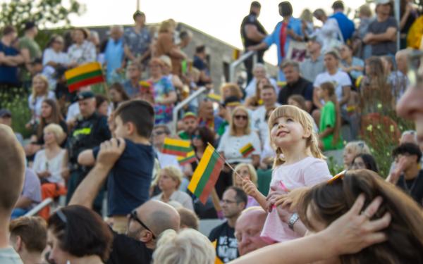 A Lithuanian girl in a crowd celebrating their statehood day