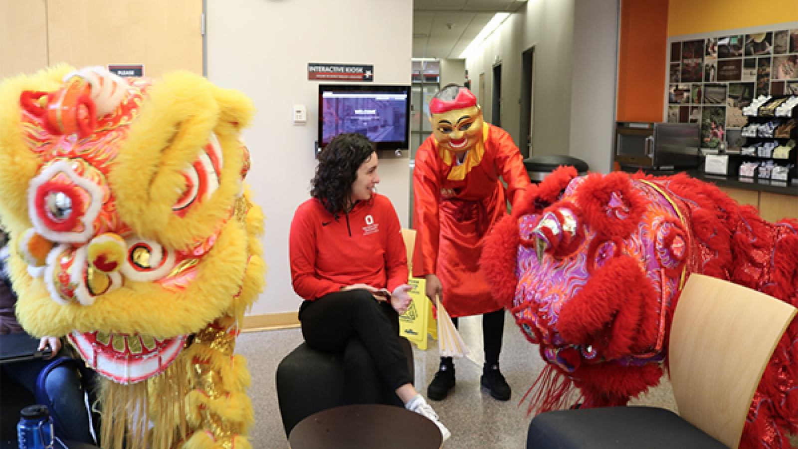 Two Chinese lions performing