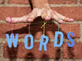 "words" spelled out in someone's hand