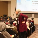 Students and parents in Hagerty 180 listening to Janice Aski