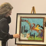 Parvaneh Hosseini displays her textiles for a presentation.